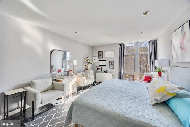 bedroom featuring a wall of windows