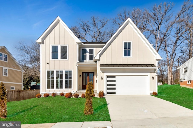 view of front facade featuring a garage and a front lawn