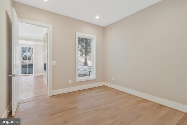 spare room with light hardwood / wood-style floors