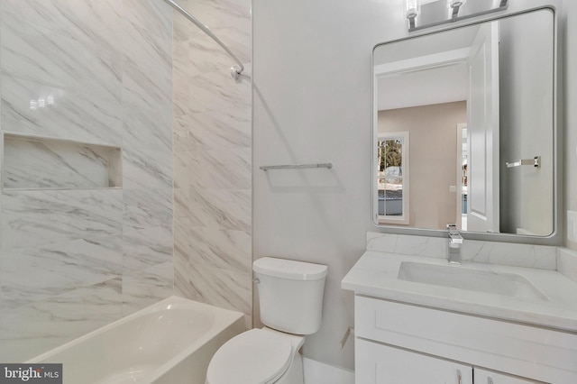 full bathroom with tiled shower / bath combo, toilet, and vanity