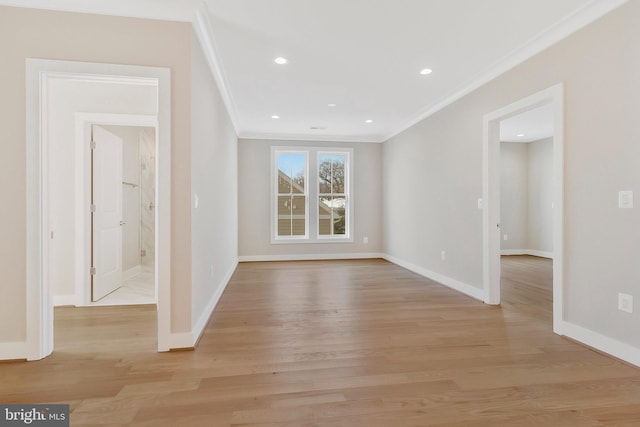 interior space with light hardwood / wood-style flooring and ornamental molding