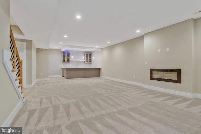 basement with light carpet and sink