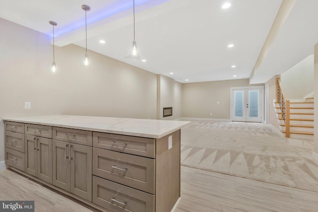 bar featuring light stone countertops, pendant lighting, french doors, light hardwood / wood-style floors, and beam ceiling