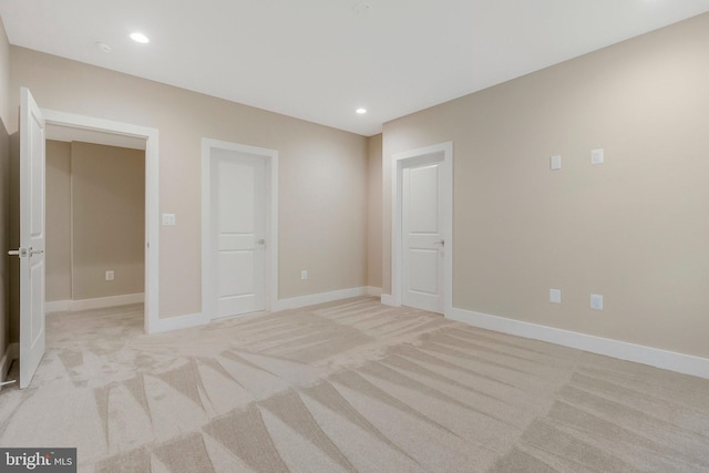 unfurnished bedroom with light carpet