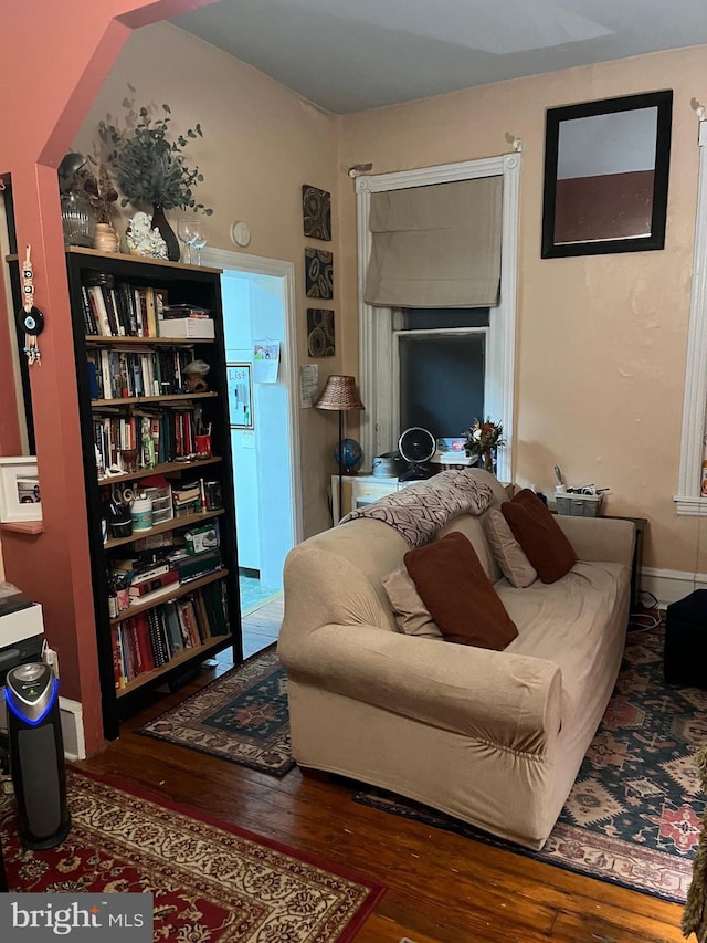 living room with dark hardwood / wood-style flooring