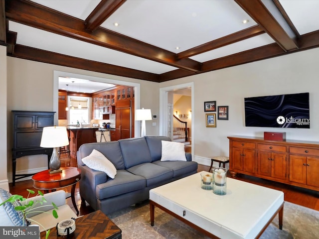 living room featuring hardwood / wood-style floors, beam ceiling, and coffered ceiling