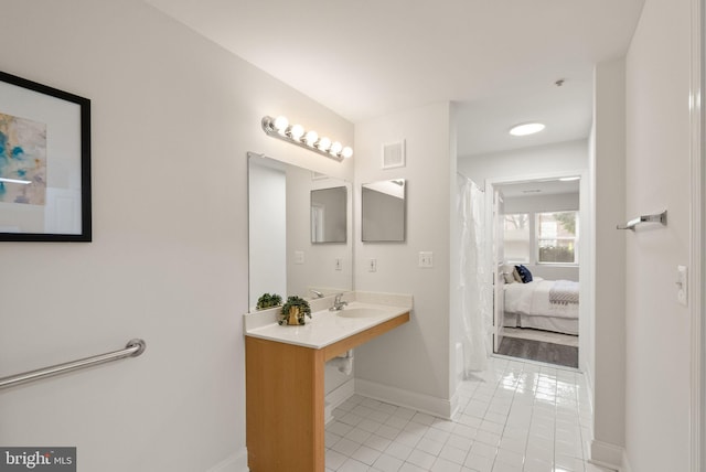 bathroom featuring sink and tile patterned floors