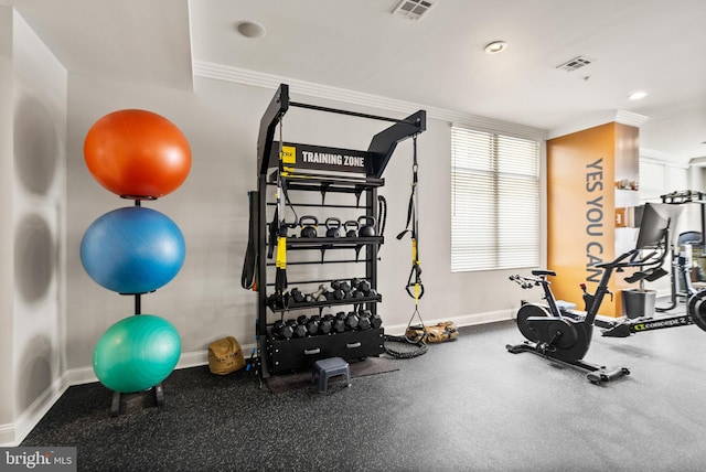 workout area with crown molding