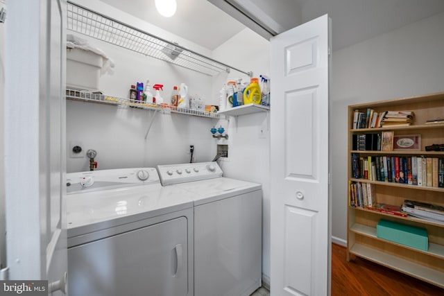 laundry room featuring dark wood-type flooring and washing machine and clothes dryer