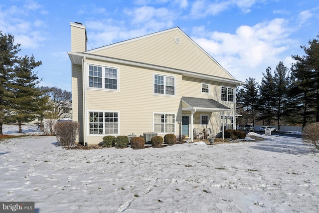 rear view of house with central AC