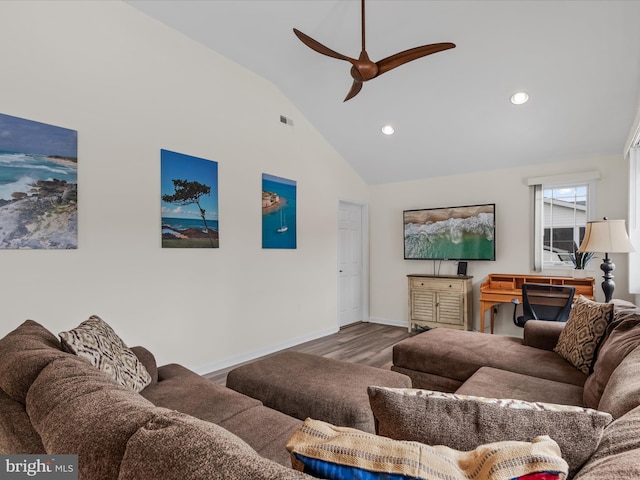 living room featuring hardwood / wood-style flooring, high vaulted ceiling, and ceiling fan