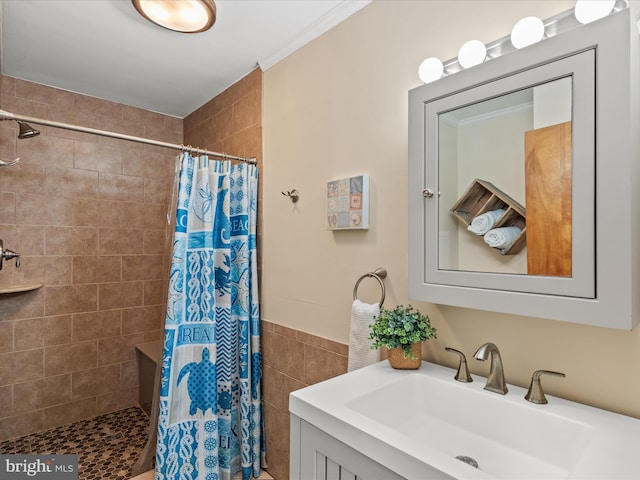 bathroom with sink, crown molding, tile walls, and a shower with shower curtain