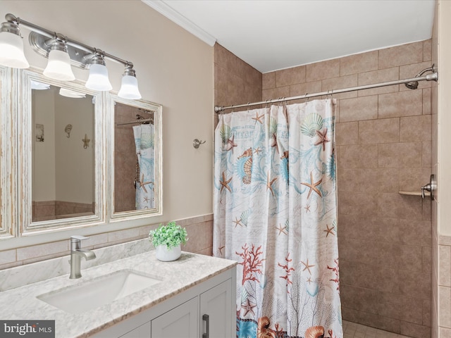 bathroom with walk in shower, ornamental molding, and vanity