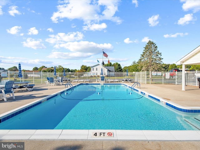 view of swimming pool featuring a patio area