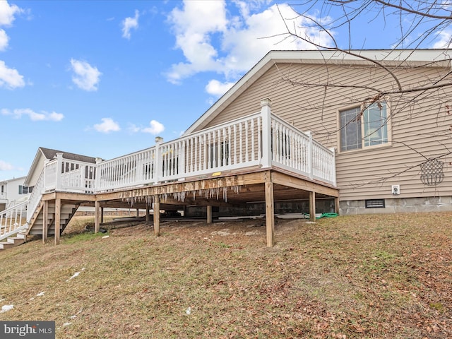 back of property with a wooden deck