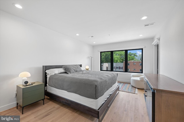 bedroom featuring light wood-type flooring