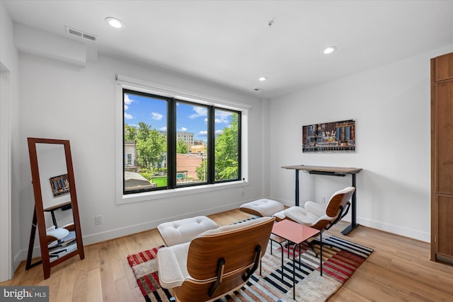 sitting room featuring light hardwood / wood-style floors