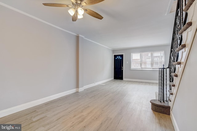 unfurnished living room with crown molding, light hardwood / wood-style floors, and ceiling fan