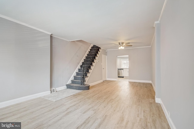 interior space featuring crown molding, ceiling fan, and light hardwood / wood-style flooring