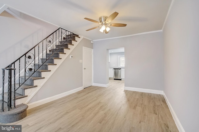 interior space with crown molding, ceiling fan, and wood-type flooring