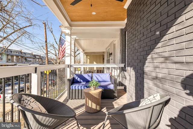 wooden deck featuring ceiling fan