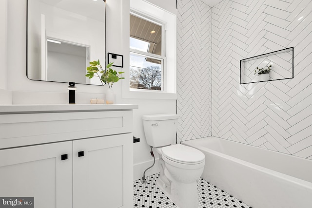 bathroom with vanity, toilet, and tile patterned flooring