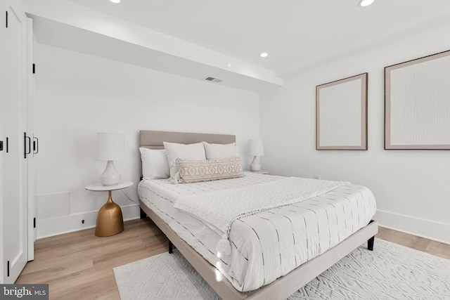 bedroom with light hardwood / wood-style flooring