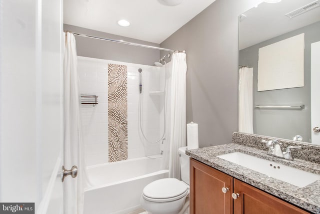 full bathroom featuring vanity, toilet, and shower / tub combo with curtain