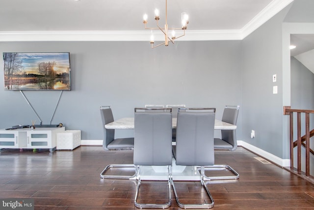 dining space featuring crown molding, a chandelier, and dark hardwood / wood-style flooring