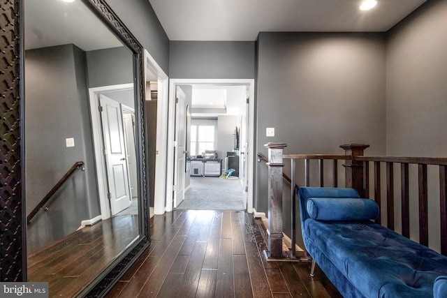 corridor featuring dark hardwood / wood-style floors