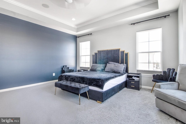 bedroom featuring ceiling fan, carpet flooring, a tray ceiling, and ornamental molding