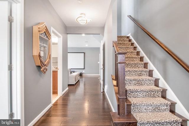 stairs with wood-type flooring