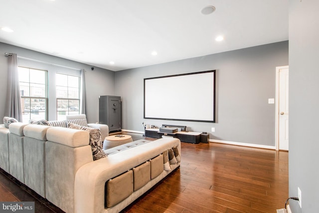 home theater room featuring dark hardwood / wood-style flooring