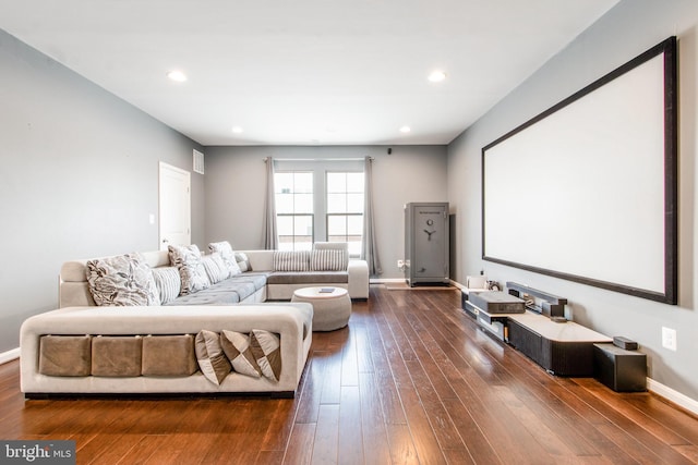 home theater room featuring dark hardwood / wood-style flooring