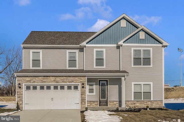 view of front of property featuring a shingled roof, an attached garage, board and batten siding, stone siding, and driveway