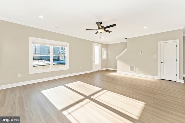 unfurnished living room with hardwood / wood-style flooring, ceiling fan, and ornamental molding