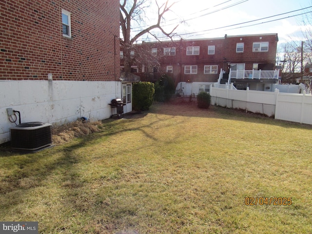 view of yard with central air condition unit