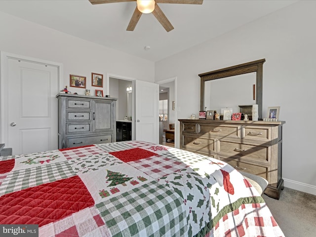 bedroom featuring ceiling fan, ensuite bathroom, and carpet flooring