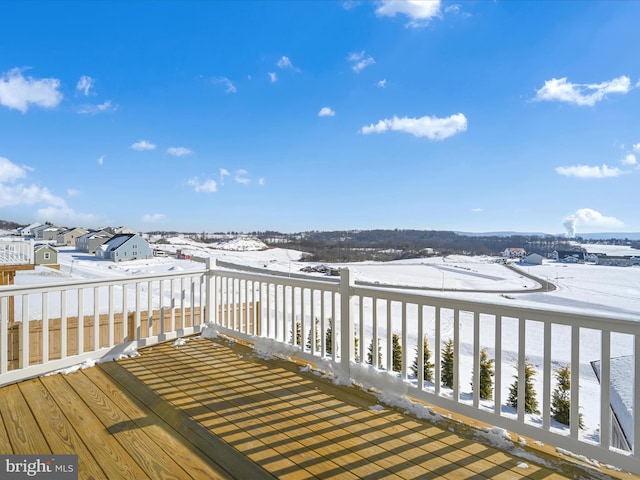 view of snow covered deck