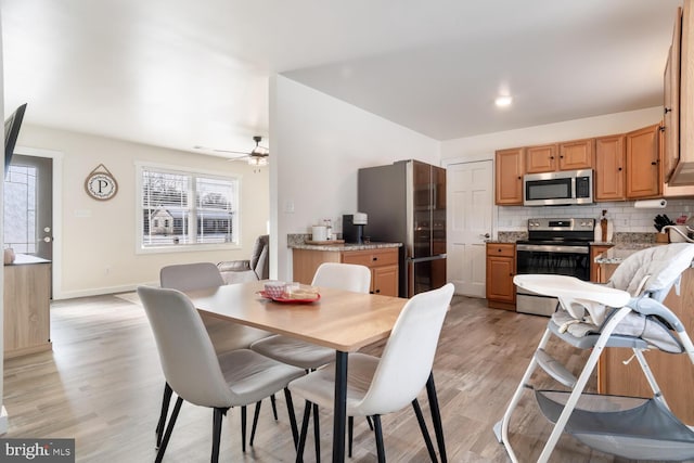 dining room featuring ceiling fan and light hardwood / wood-style floors