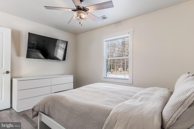 bedroom featuring ceiling fan and light wood-type flooring