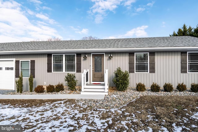 ranch-style house featuring a garage