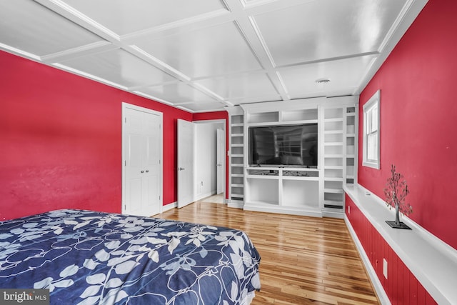 bedroom with hardwood / wood-style flooring and coffered ceiling