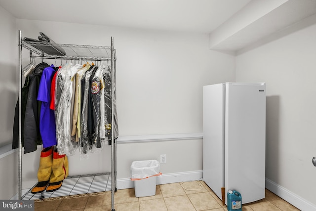 spacious closet featuring light tile patterned floors