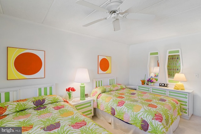 bedroom featuring ceiling fan and light colored carpet