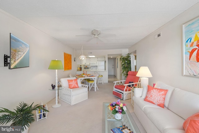 living room featuring light colored carpet and ceiling fan