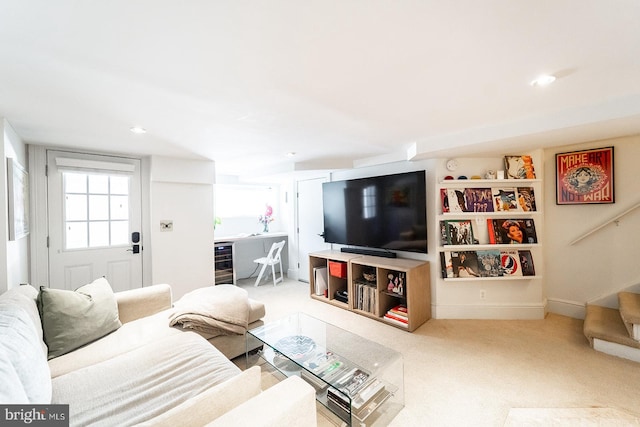 carpeted living room featuring beverage cooler