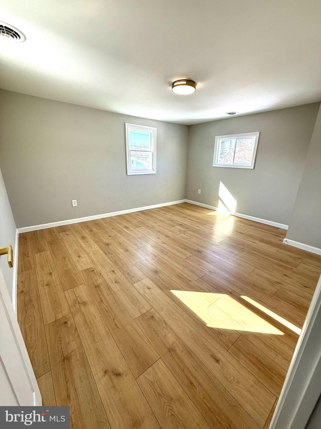 spare room with light hardwood / wood-style floors