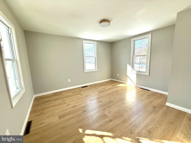 unfurnished room with light hardwood / wood-style flooring