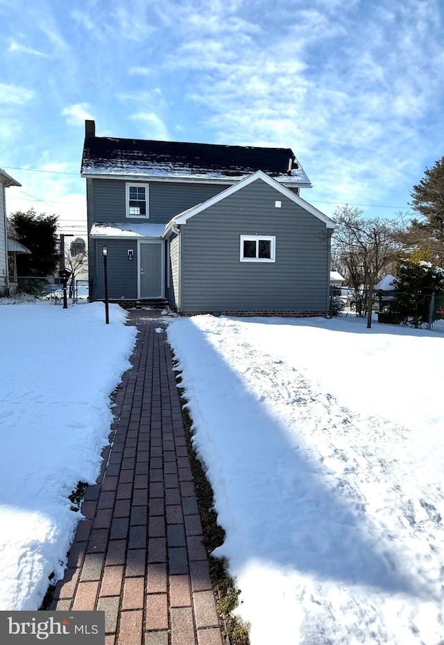 view of snow covered property